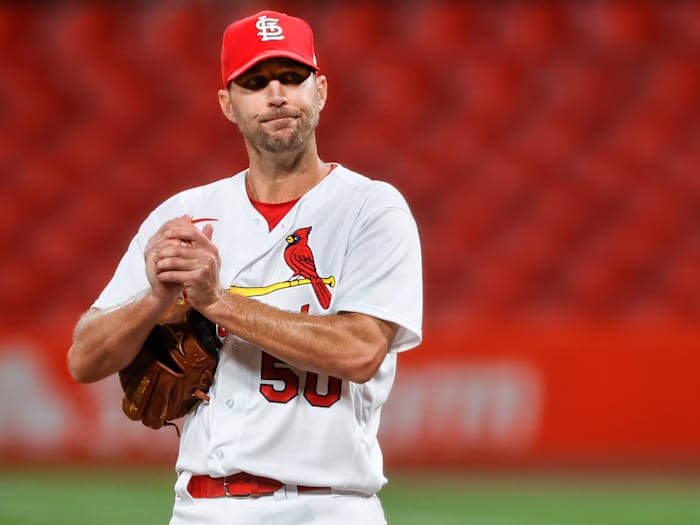 Adam Wainwright holds a baseball
